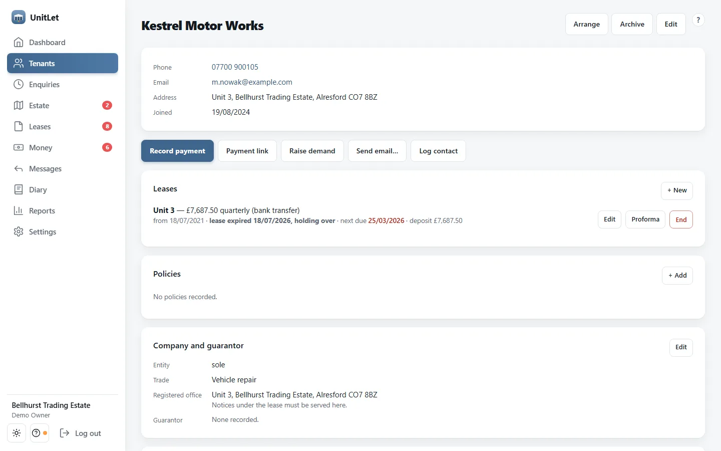 A tenant's page on a laptop: Kestrel Motor Works with phone, email and address, their lease on Unit 3 at £7,687.50 quarterly by bank transfer, which began in July 2021 and is marked “lease expired 18/07/2026, holding over” because the term has run out and the tenant is still there under the 1954 Act, with the next rent date shown in red and the deposit held, and the company details recording the registered office where notices under the lease must be served.